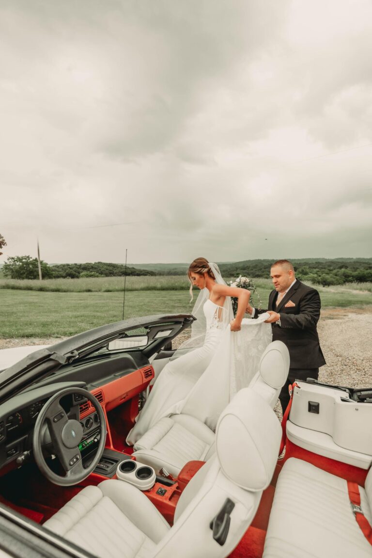 Bridge and Groom getting in a car