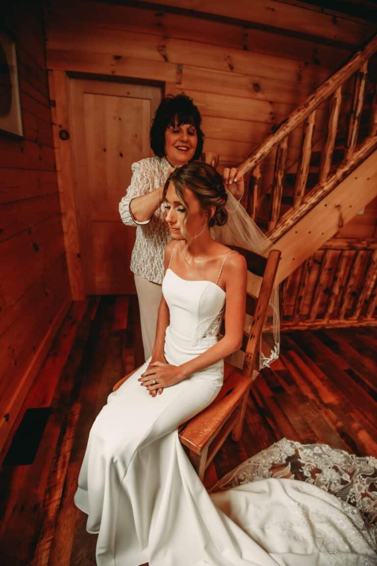 Bride having her wedding veil put on