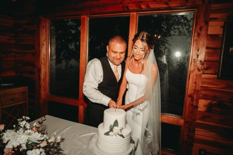 Couple cutting cake at their wedding
